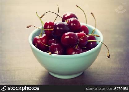 cherry berries in blue bowl