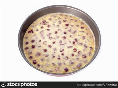 cherry clafoutis in front of white background