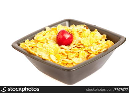 cherry in a bowl with cornflakes isolated on white
