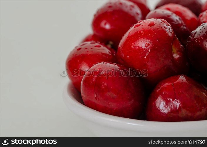 Cherry isolated. Cherry on white background. There are cherries in the white bowl .