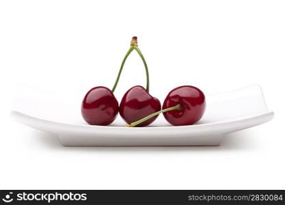 cherry on a plate. cherry on white background