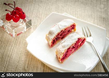 Cherry strudel on the square plate