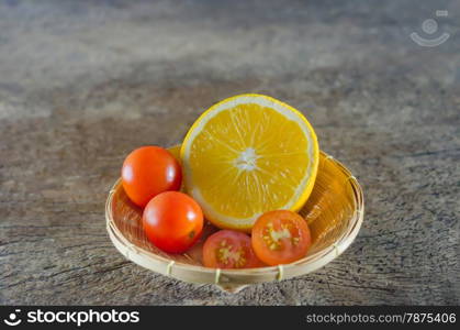 cherry tomato and orange. Red cherry tomatoes and orange