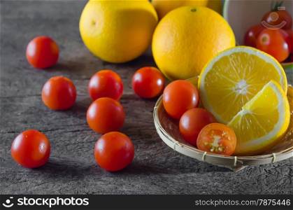 cherry tomato and orange. Red cherry tomatoes and orange