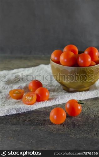 cherry tomato. Red cherry tomatoes on a textured wooden background