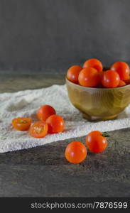 cherry tomato. Red cherry tomatoes on a textured wooden background