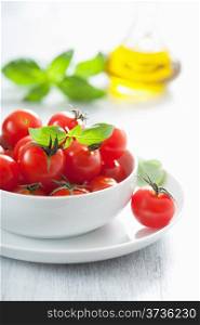 cherry tomatoes and basil in bowl