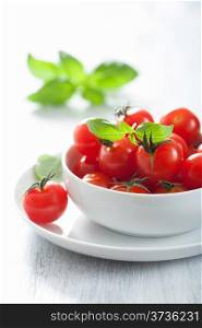 cherry tomatoes and basil in bowl