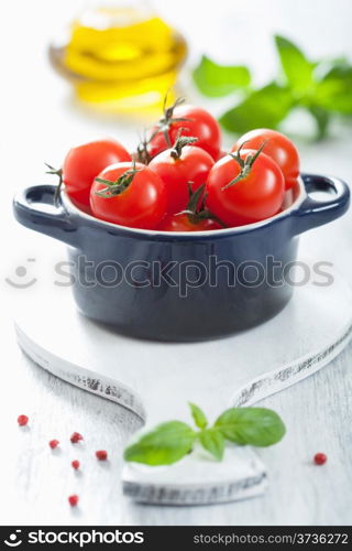 cherry tomatoes and basil in casserole