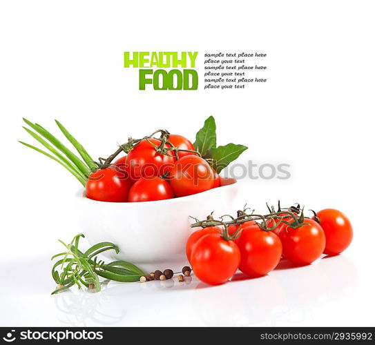 Cherry tomatoes and garlic on white background.