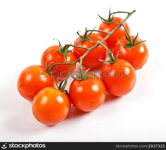 Cherry tomatoes and garlic on white background.