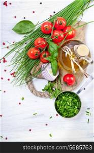Cherry Tomatoes, chives and peppers on white