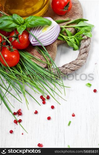 Cherry Tomatoes, chives and peppers on white