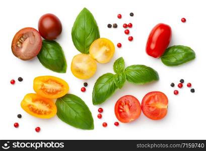 Cherry tomatoes composition isolated on white background. Red, yellow and brown tomato with fresh basil and peppercorns. Top view
