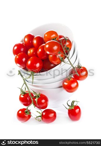 cherry tomatoes in a bowl on white background