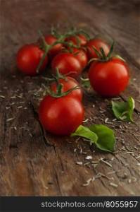 Cherry tomatoes on a wooden surface with natural light