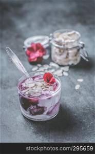 Cherry yogurt with almonds and flowers