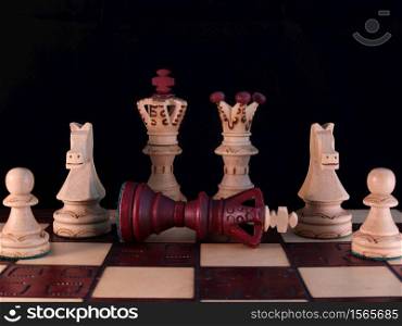 Chess family photo with the defeated king.. Chess family photo with the defeated king