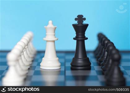 Chess game and blue background. Conceptual scene.
