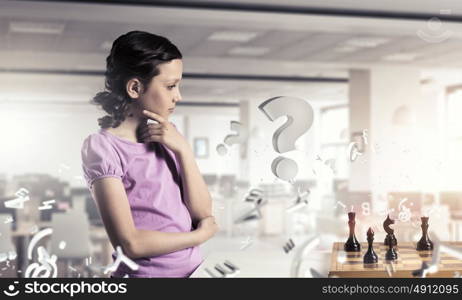 Chess game for clever mind. Young caucasian kid girl playing game of chess