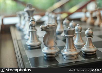 Chess is placed on a table for the evening entertainment adds stress and loneliness, brain development. soft focus