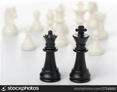 Chess king and queen. Black figures, concept of dialogue
