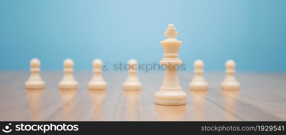 Chess King standing to Be around of other chess, Concept of a leader must have courage and challenge in the competition, leadership and business vision for a win in business games