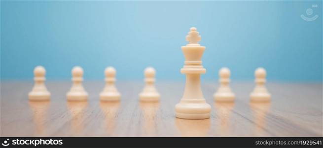 Chess King standing to Be around of other chess, Concept of a leader must have courage and challenge in the competition, leadership and business vision for a win in business games