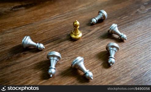 Chess leadership  victory concept with gold winner stand alone with fallen silver chess pieces King wins the game Decision and achievement goal concept with chess figures.