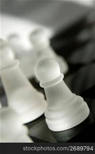 Chess pieces lying on chess board, close-up