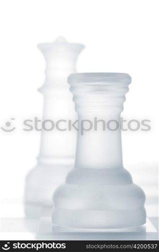 chess rook is defending queen, cut out from white