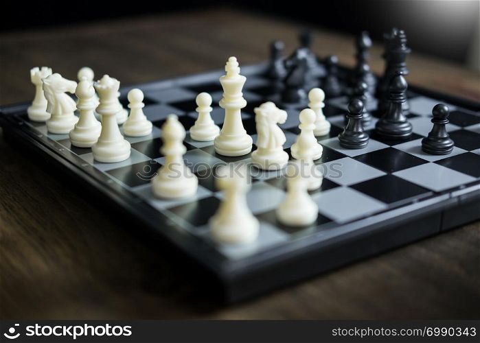Chess set on the chess board of business ideas and competition and stratagy plan success meaning