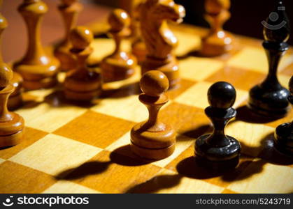 Chessboard with figures on dark background