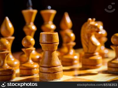 Chessboard with figures on dark background. Chessboard with figures