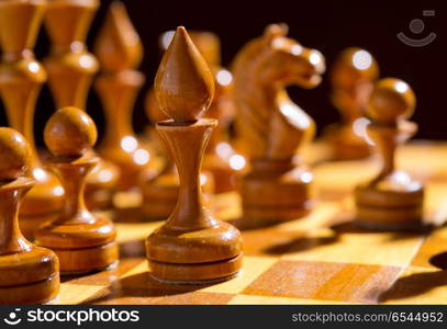 Chessboard with figures on dark background. Chessboard with figures on dark