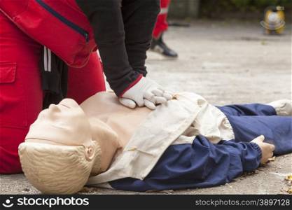 Chest massage performed on CPR dummy