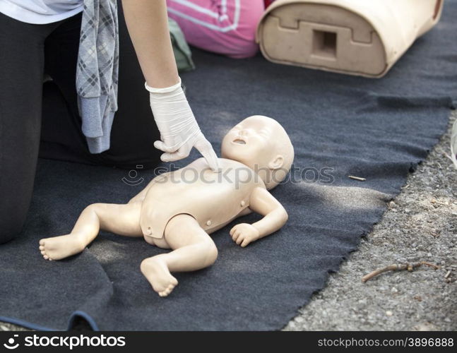 Chest massage performed on infant dummy