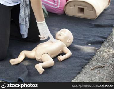 Chest massage performed on infant dummy