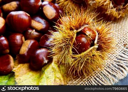 Chestnuts on an old board.