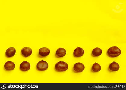 Chestnuts pattern on yellow background, top view, chestnut, castanea