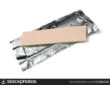 Chewing gum on the wrapping foil isolated on white