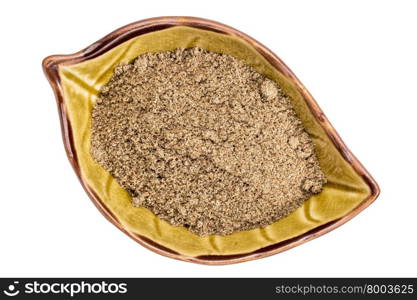 chia seed flour in a ceramic leaf shaped bowl isolated on white, top view