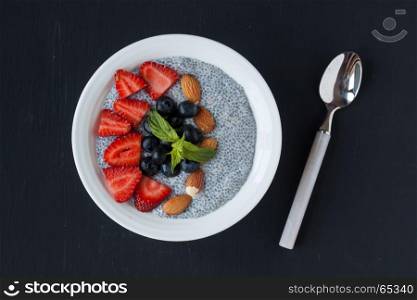 chia seed pudding on a black backgound