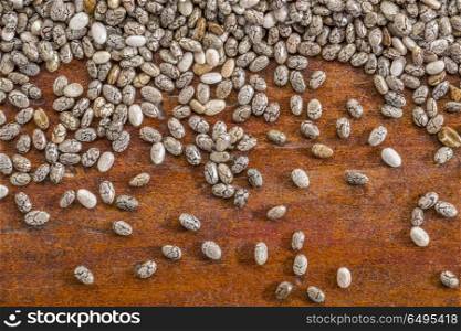 chia seeds on a rustic wood - close up background