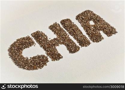 chia word made from chia seeds on white artist canvas