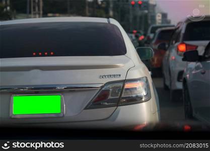 Chiang Mai, Thailand - 18 December 2021 : Rush hour cars in the city streets in the evening. Cars on the highway in traffic jams.