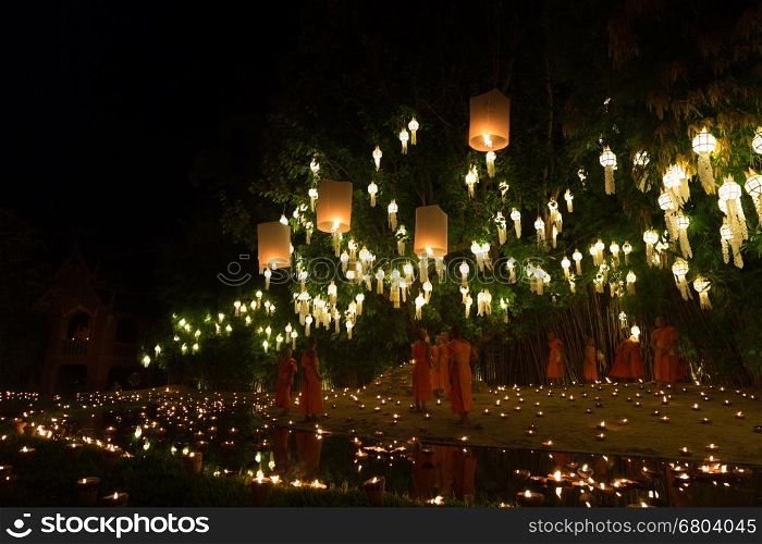 Chiang Mai, Thailand - November 14, 2016: buddhist monk floating hot air balloon in Yeepeng and Loy Krathong festival at Puntao temple in Chiang Mai, Thailand on November 14, 2016.