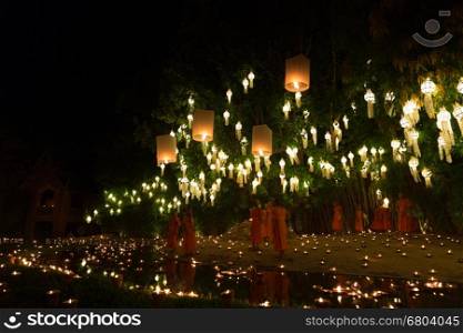 Chiang Mai, Thailand - November 14, 2016: buddhist monk floating hot air balloon in Yeepeng and Loy Krathong festival at Puntao temple in Chiang Mai, Thailand on November 14, 2016.