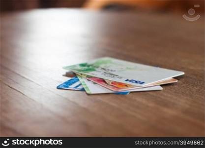 CHIANG RAI, THAILAND - March 3, 2016: Visa cards on wooden table, stock photo