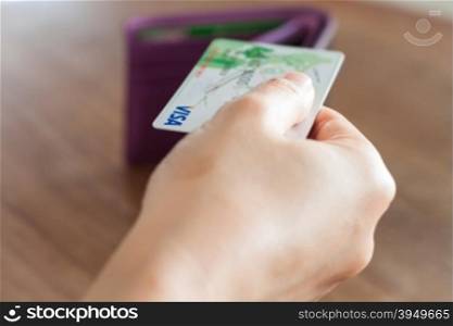 CHIANG RAI, THAILAND - March 3, 2016: Woman&rsquo;s hand holding visa card, stock photo